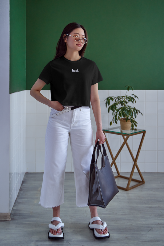Solid black "heal." tee